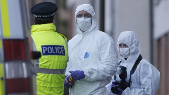 Police forensic officers near the family home of Mikaeel Kular in Edinburgh