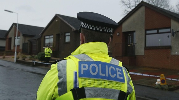 Police cordon off a property.