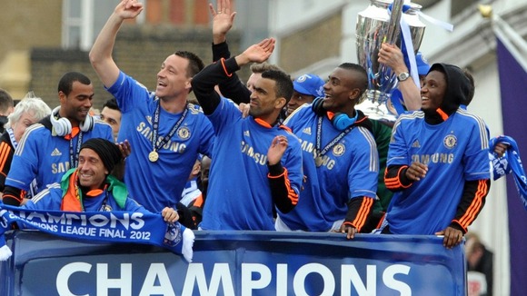 Chelsea players on the bus during the FA Cup and UEFA Champions League trophy parade in London