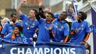 Chelsea players on the bus during the FA Cup and UEFA Champions League trophy parade in London