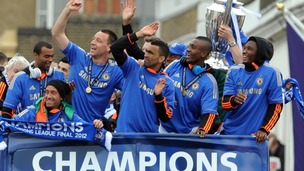 Chelsea players on the bus during the FA Cup and UEFA Champions League trophy parade in London