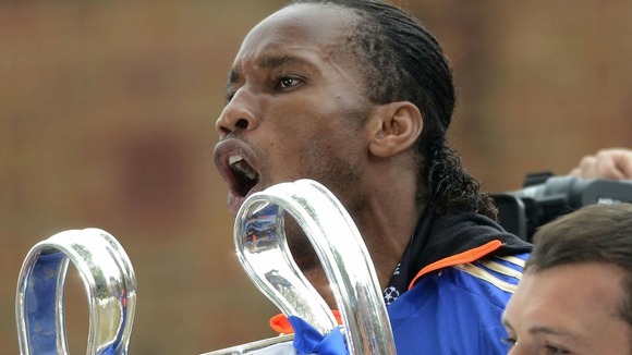 Chelsea's Didier Drogba with the Champions League trophy during the FA Cup and UEFA Champions League trophy parade in London