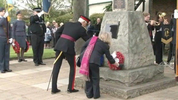 Private Ford's mother, Jane, lays a wreath at the memorial