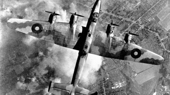 An RAF Halifax bomber pictured during an attack on an oil plant in Germany's Ruhr