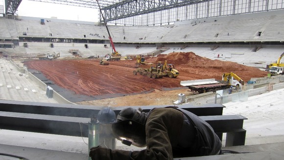 A welder at work in the Arena da Baixada stadium in Curitiba