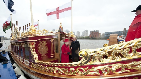 The Queen visits "The Gloriana" which will be leading the Thames river pageant.
