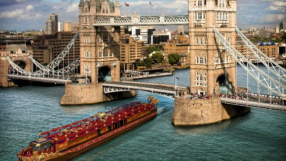 An artist's impression of the royal barge passing by Tower Bridge.