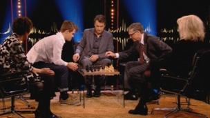 Bill Gates prepares to make his move against Norwegian world chess champion Magnus Carlsen.