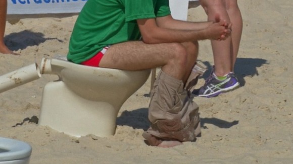 Another protester on the toilet.