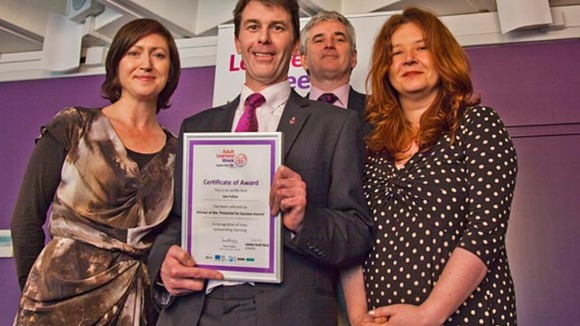 Jon Fullan receiving the award