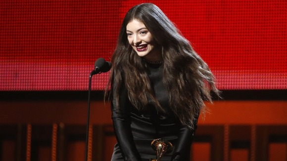 Lorde with her award.