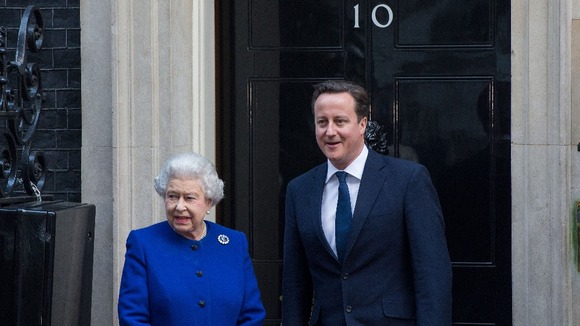 Queen Elizabeth ll is greeted by Prime Minister David Cameron