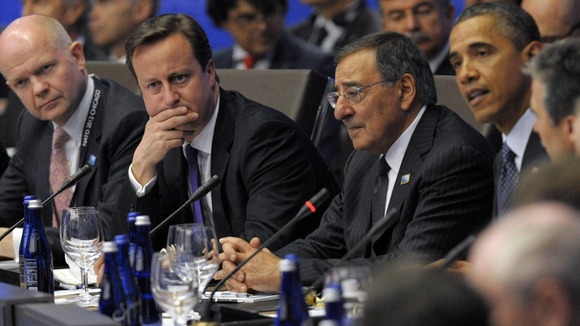 William Hague and David Cameron listen to Barack Obama at the G8 meeting