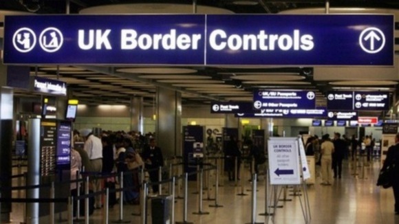 A UK Border Control checkpoint at an airport.
