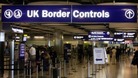 A UK Border Control checkpoint at an airport.