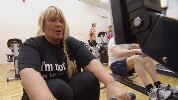 Woman on rowing machine