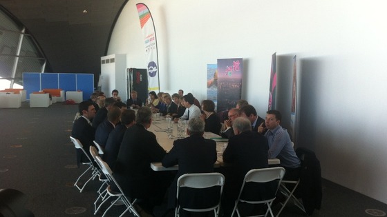 The shadow cabinet seated round a table.
