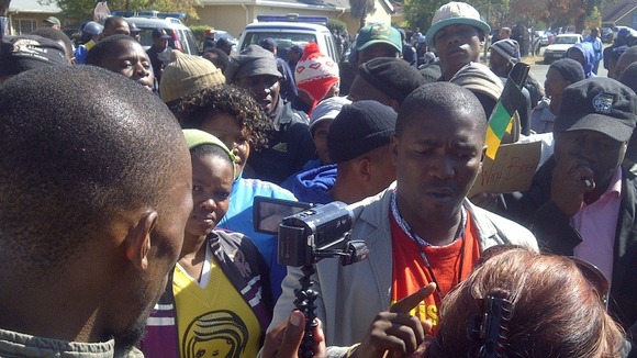 Supporters of the farm workers have set up a counter-protests outside the courthouse