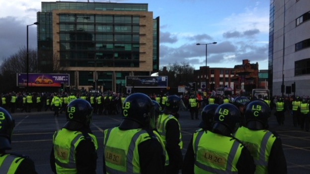 Lines of police officers monitor the crowds after Tyne-Wear derby.