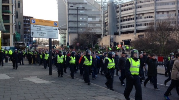 Police escort fans away from St James' Park, Newcastle.