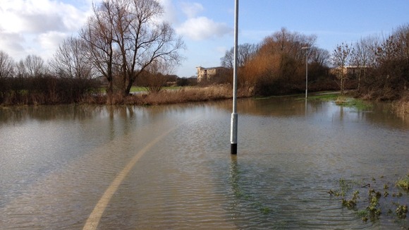 A cycle path underwater near the river Chelmer