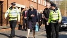 Home Secretary Theresa May walks around the St George's Estate in Hulme