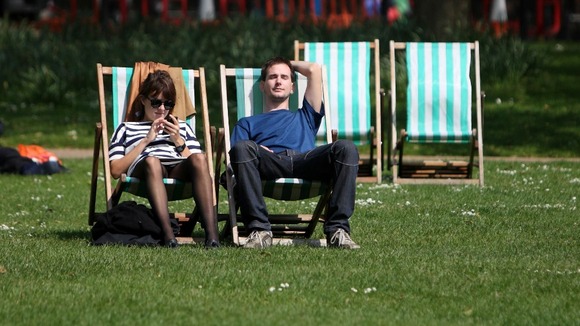 Sunbathers in St James' Park in Central London enjoying the warm May weather