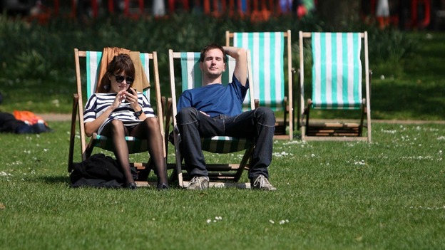 Sunbathers in St James' Park in Central London enjoying the warm May weather