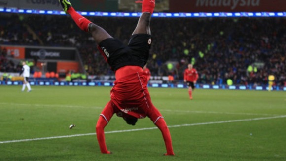 Kenwyne Jones is head over heels after scoring Cardiff's winning goal.