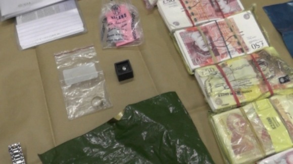 Cash, diamonds and designer watches were found in raids on safe deposits boxes.