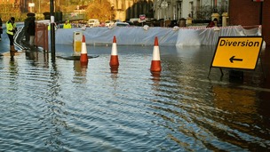 River defence barriers are put in place as the river Avon in Bristol.