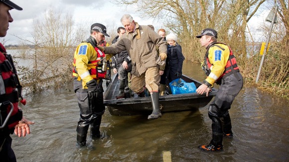 The Prince of Wales arrives in Muchelney in Somerset.
