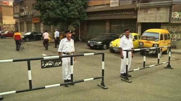 Guards outside a polling station in Cairo
