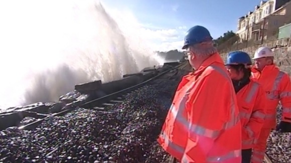 Transport Secretary Patrick McLoughlin surveys the damage