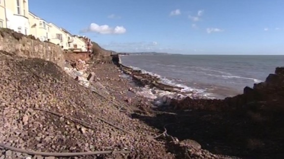 A large section track has been undermined by large waves