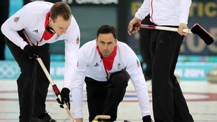 Great Britain's David Murdoch (C) with Michael Goodfellow (L) during curling training at the Ice Cube Curling Centre.