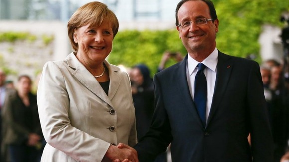 German Chancellor Angela Merkel welcomes French President Francois Hollande at the Chancellery in Berlin at the beginning of May