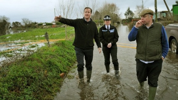 David Cameron with Bridgwater and West Somerset MP Ian Liddell-Grainger (right) during a visit to Goodings Farm in Fordgate, Somerset