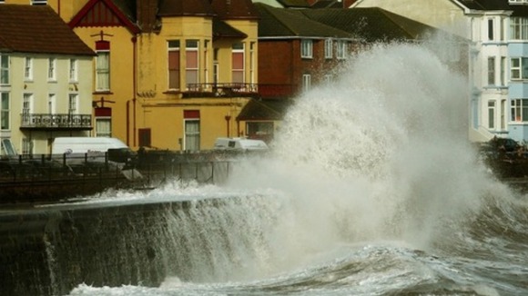 Waves crash into the coast at Dawlish in Devon
