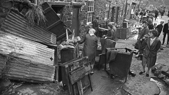 Residents of Pensford in Somerset clean up debris left by the flooding of 1968.