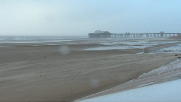Sand shift as the beach is hit with high winds.