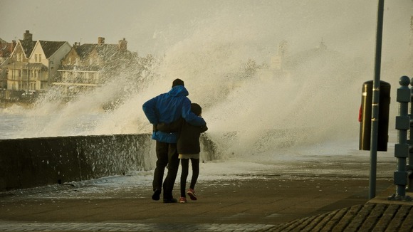 People struggle to make their way along the Esplanade, Porthcawl, south Wales.