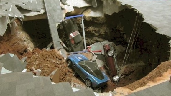 Eight of the classic cars were swallowed by the huge pit.