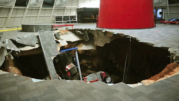Eight of the classic cars were swallowed by the huge pit.