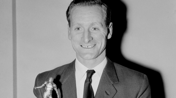 Tom Finney holds up the Footballer of the Year trophy in 1957, becoming the first player to win the award twice