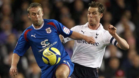 Stevenage's Joel Byrom (left) and Tottenham Hotspur's Scott Parker