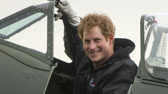 Prince Harry climbed into the cockpit of a Spitfire and started the engine.