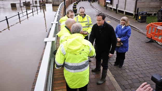 Prime Minister David Cameron chats with employees of the Environment Agency in Upton-upon-Severn.