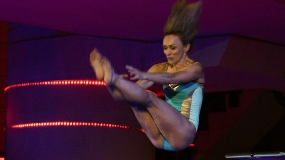 Michaela Strachan pictured mid-dive during Semi Final One.