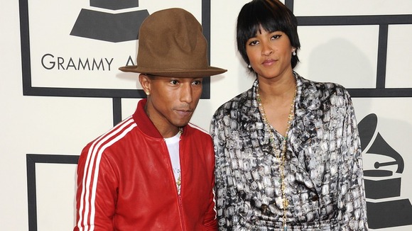 Pharrell Williams and Helen Lasichanh arrives for the 56th annual Grammy Awards on January 26, 2014.